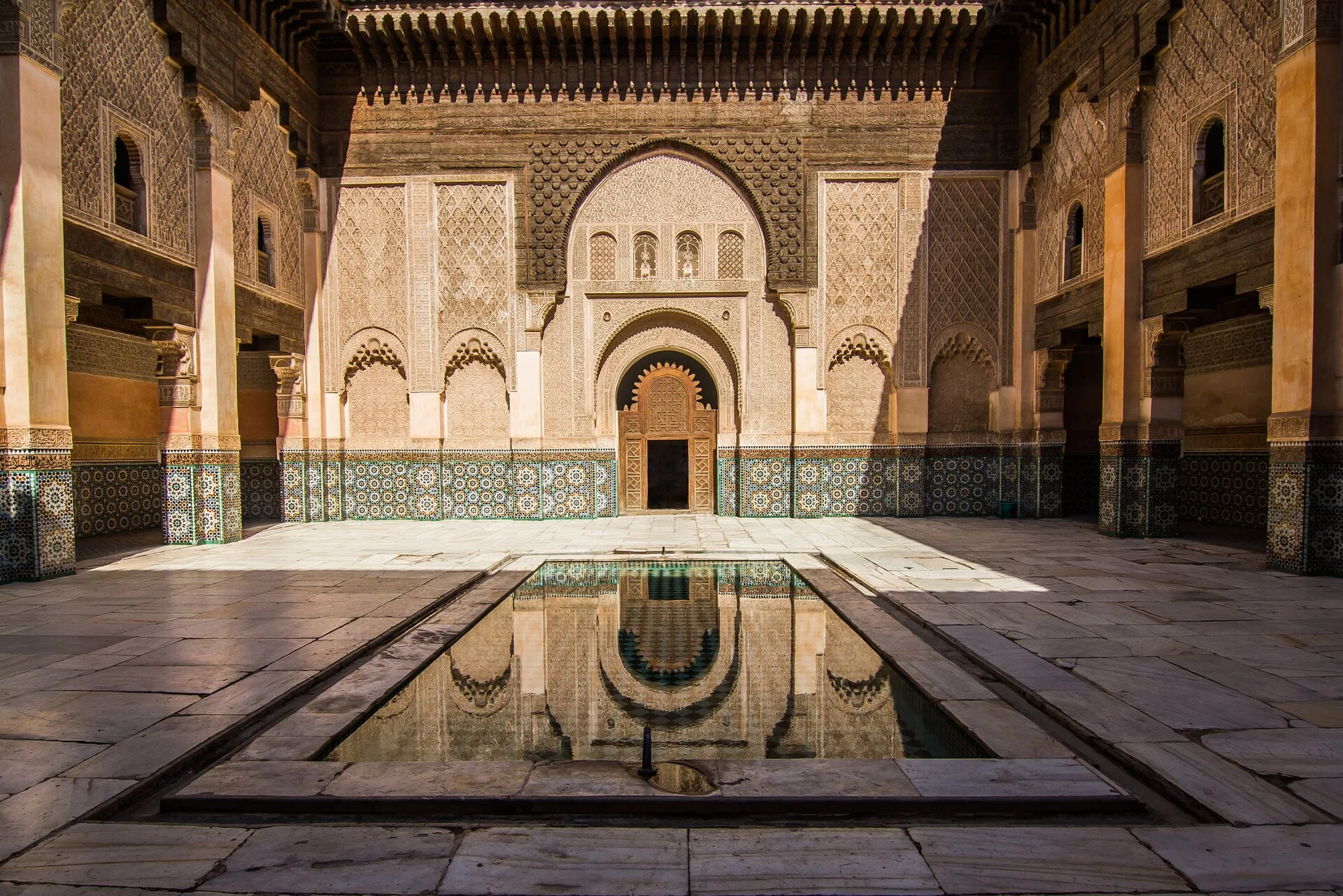 Intricate courtyard architecture at Ben Youssef Madrasa in Marrakech