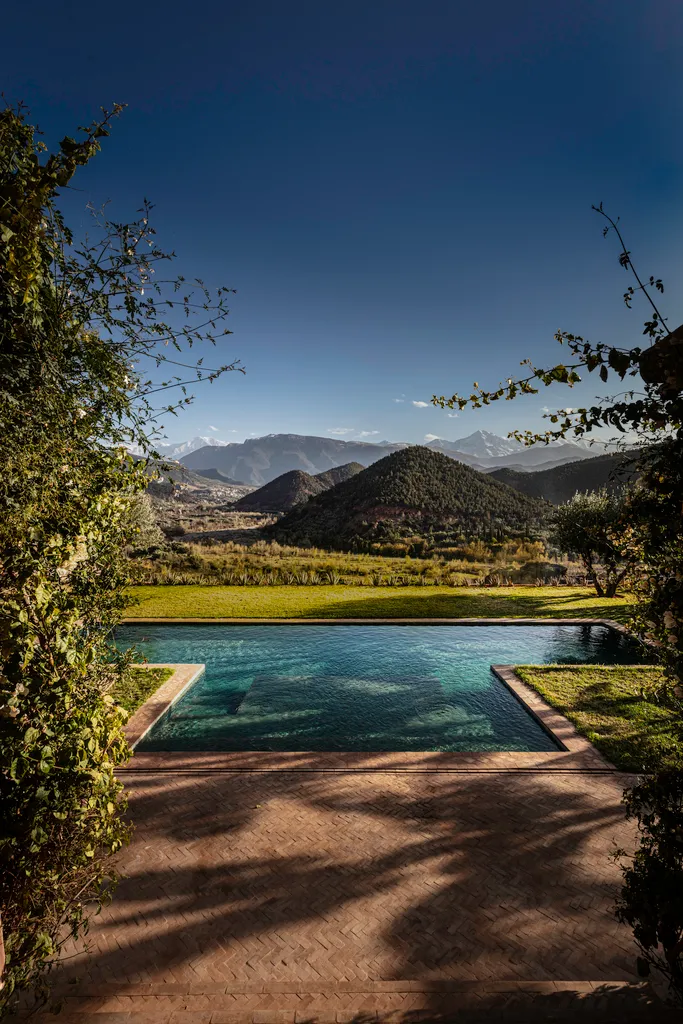 The Retreat pool and terrace at Kasbah Bab Ourika overlooking the valley